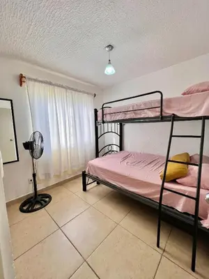 Cama o camas de una habitación en Departamento planta baja en Acapulco Diamante