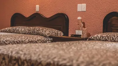 Cama o camas de una habitación en Hotel Aurora