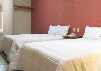 Cama o camas de una habitación en Hotel Malinalli Bella Vista
