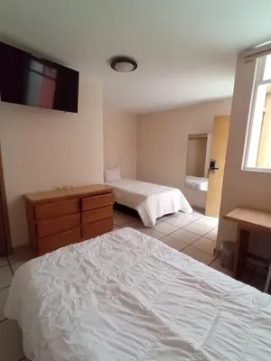 Cama o camas de una habitación en Hotel Malinalli Bella Vista