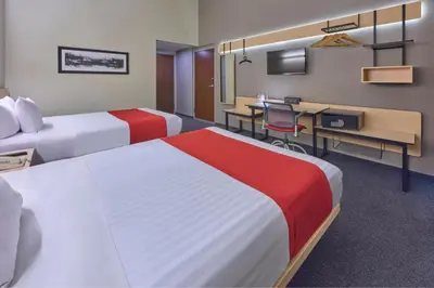Cama o camas de una habitación en City Express Plus by Marriott Ciudad de México Patio Universidad