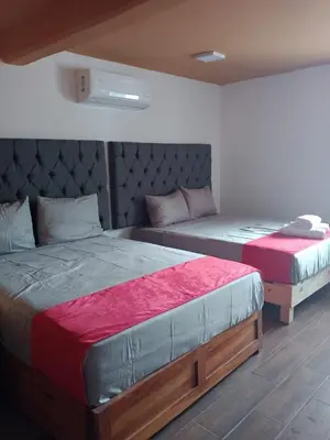Cama o camas de una habitación en Hotel La Intimidad