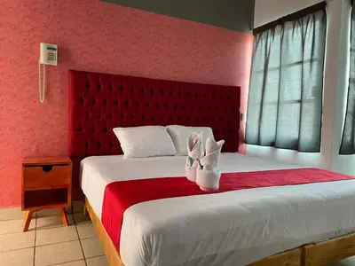 Cama o camas de una habitación en Hotel La Intimidad