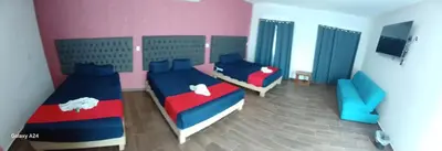 Cama o camas de una habitación en Hotel La Intimidad