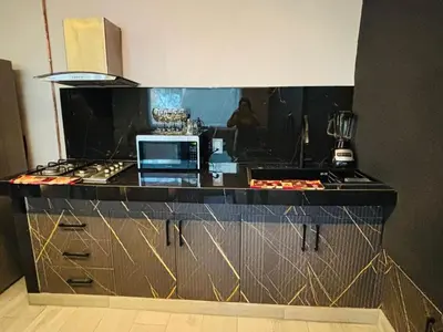 Una cocina o zona de cocina en Depa Frente al aeropuerto hasta 12 Huéspedes
