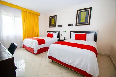Cama o camas de una habitación en Eco City Hoteles