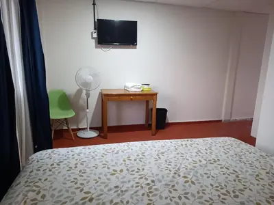 Cama o camas de una habitación en Hotel Posada Los Faroles Atlixco