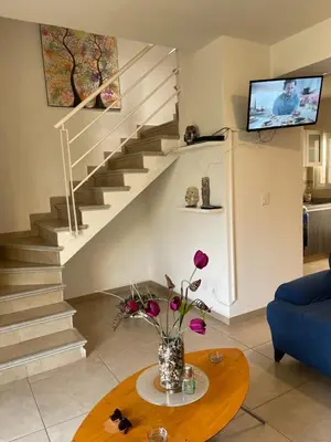 Una televisión o centro de entretenimiento en Casa de tus Sueños Dream Lagoons Veracruz