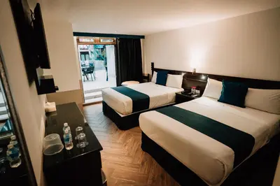 Cama o camas de una habitación en Hotel San Pedro Puebla