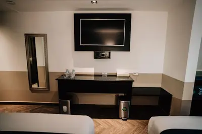 Una televisión o centro de entretenimiento en Hotel San Pedro Puebla