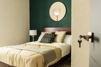 Cama o camas de una habitación en **Con Club de Playa y Alberca : Hasta 18 huéspedes**