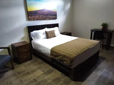 Cama o camas de una habitación en Hostería Tocali
