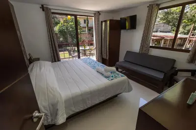 Cama o camas de una habitación en El descanso casa-hotel zacatlán.