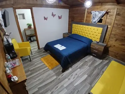 Cama o camas de una habitación en El descanso casa-hotel zacatlán.