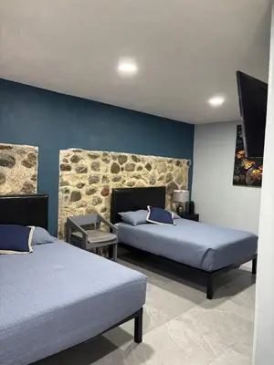 Cama o camas de una habitación en La Cabaña
