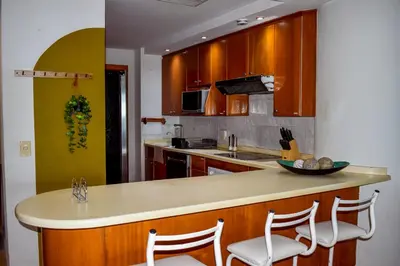 Una cocina o zona de cocina en Departamento Mayan Island - A pie de playa y con albercas