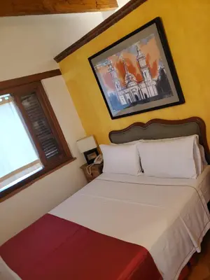 Cama o camas de una habitación en La Joyita Cuernavaca