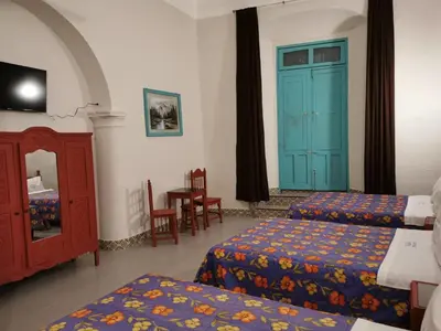 Cama o camas de una habitación en HOTEL LIMÓN