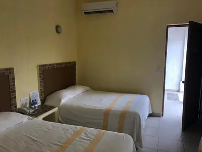 Cama o camas de una habitación en Hotel Maria Mixteca