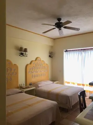 Cama o camas de una habitación en Hotel Maria Mixteca
