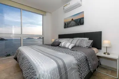 Cama o camas de una habitación en Luxury apartment in front of Acapulco Beach