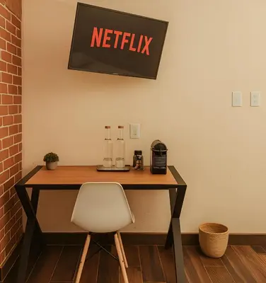Una televisión o centro de entretenimiento en Hotel Casa Acueducto - Lujo Cultural