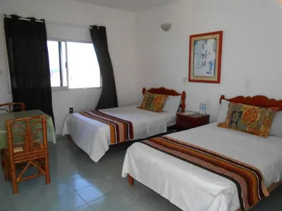 Cama o camas de una habitación en Hotel y Bungalows Monteverde