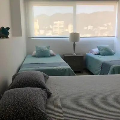 Cama o camas de una habitación en Apartamento con Piscina Frente al Mar en Acapulco