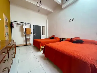 Cama o camas de una habitación en LARIMAR Gallery y Hotel Boutique