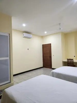 Cama o camas de una habitación en Huitzilin Hostal