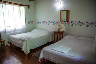Cama o camas de una habitación en Hotel Taselotzin