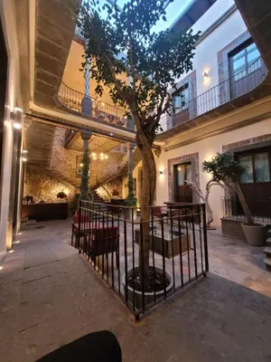 Un patio o zona al aire libre en Milo Collection Hotel