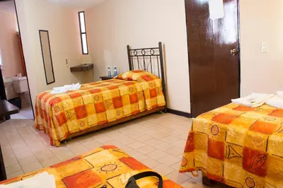 Cama o camas de una habitación en Villas Hotel Cholula