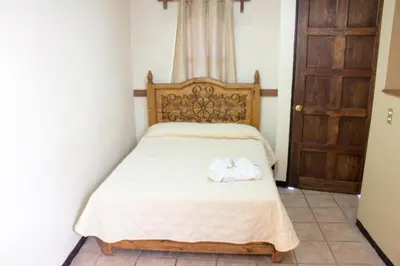 Cama o camas de una habitación en Villas Hotel Cholula