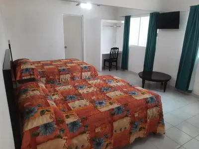 Cama o camas de una habitación en HOTEL ACUARIO CATEMACO