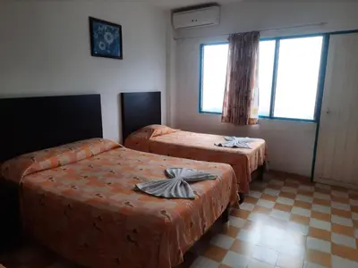 Cama o camas de una habitación en HOTEL ACUARIO CATEMACO
