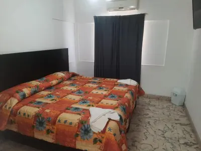 Cama o camas de una habitación en HOTEL ACUARIO CATEMACO