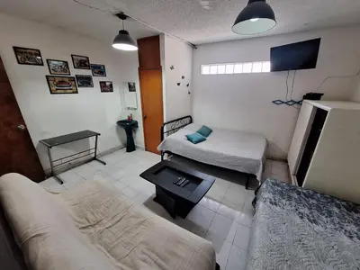 Una televisión o centro de entretenimiento en Casa Miranda Airport