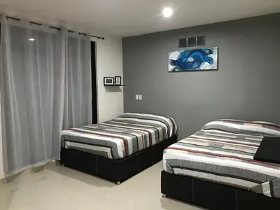 Cama o camas de una habitación en HOTEL NUEVA LUNA