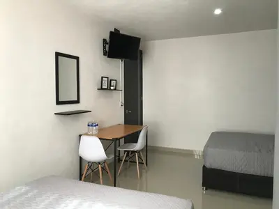Cama o camas de una habitación en HOTEL NUEVA LUNA