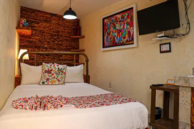 Cama o camas de una habitación en Casa Real Coyoacán