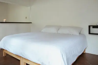 Cama o camas de una habitación en Hospedaje Temazcaltitla