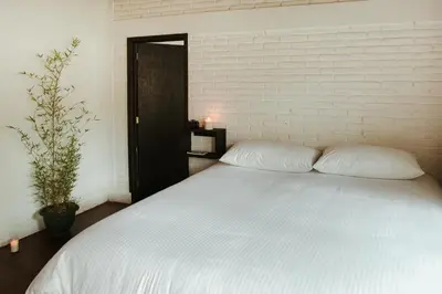 Cama o camas de una habitación en Hospedaje Temazcaltitla