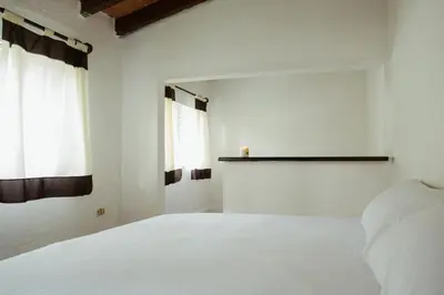 Cama o camas de una habitación en Hospedaje Temazcaltitla