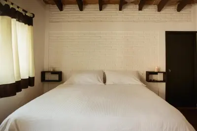 Cama o camas de una habitación en Hospedaje Temazcaltitla