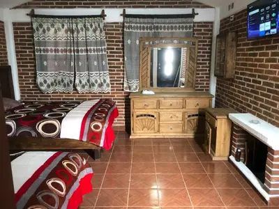 Cama o camas de una habitación en Cabañas El Manantial