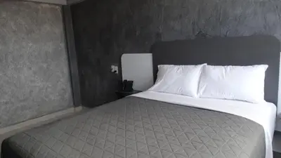 Cama o camas de una habitación en MOTEL & HOTEL ALJIBE