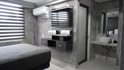 Cama o camas de una habitación en MOTEL & HOTEL ALJIBE