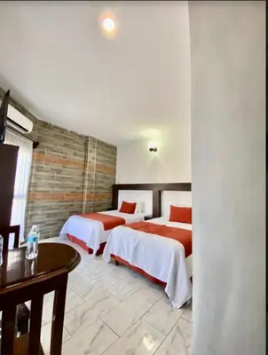 Cama o camas de una habitación en Pineda Real HOTEL