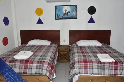 Cama o camas de una habitación en Hotel Bacaanda